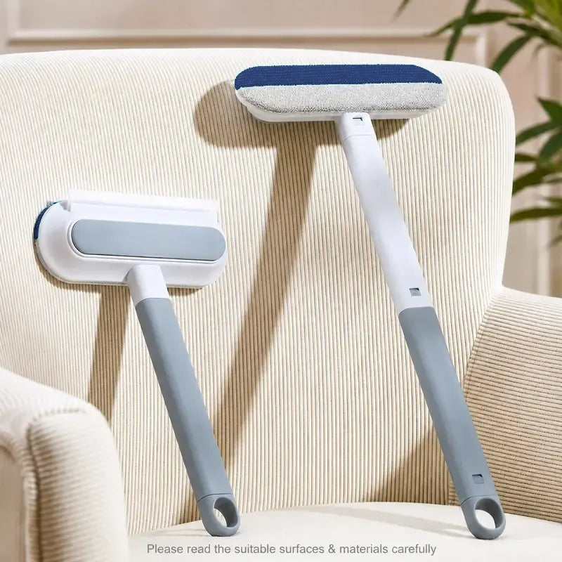 Two Fur Paddles, one with the short handle and one with the long handle, leaning on a cream armchair