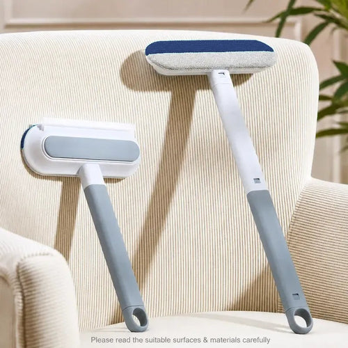 Two Fur Paddles, one with the short handle and one with the long handle, leaning on a cream armchair