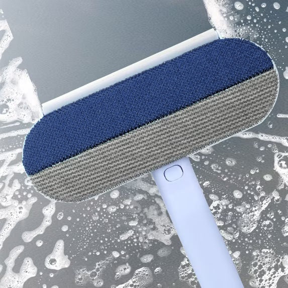 The Fur Paddle's squeegee edge against wet glass